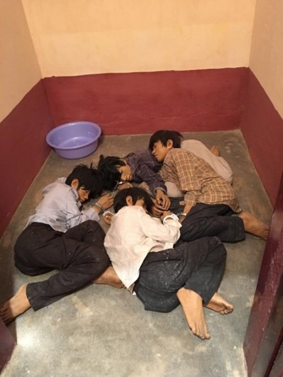 Prisoners being cuffed together