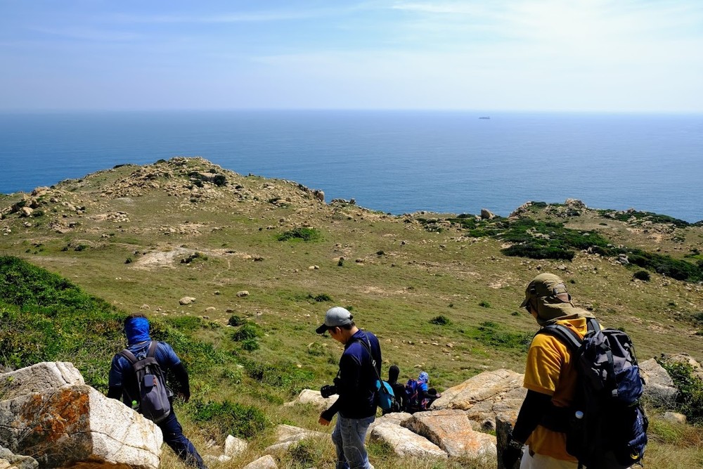 Trekkers challenge themselves with the heat and strong wind during the route.