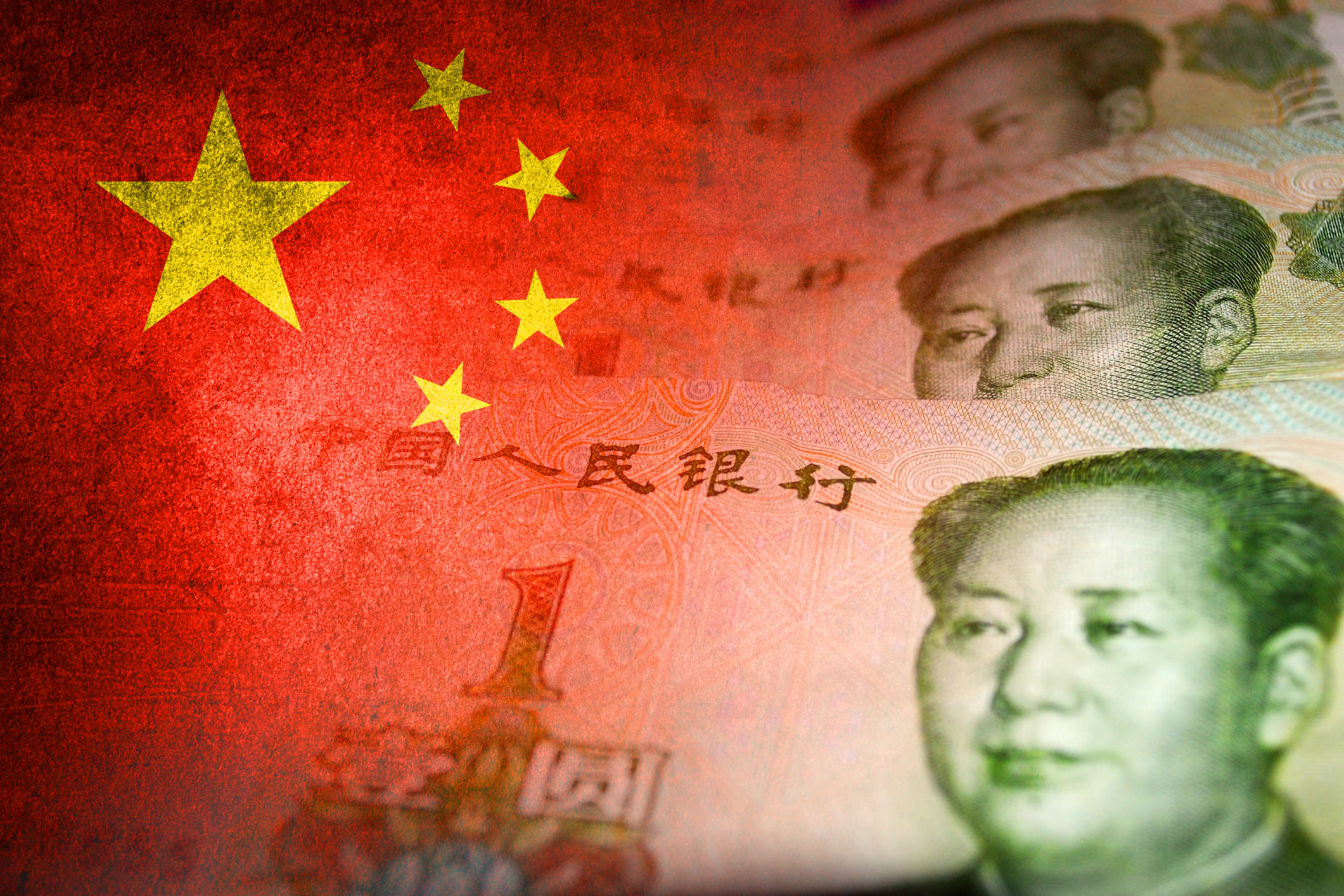 Chinese yuan cash bills and chinese flag (money, economy, finance, inflation, crisis)