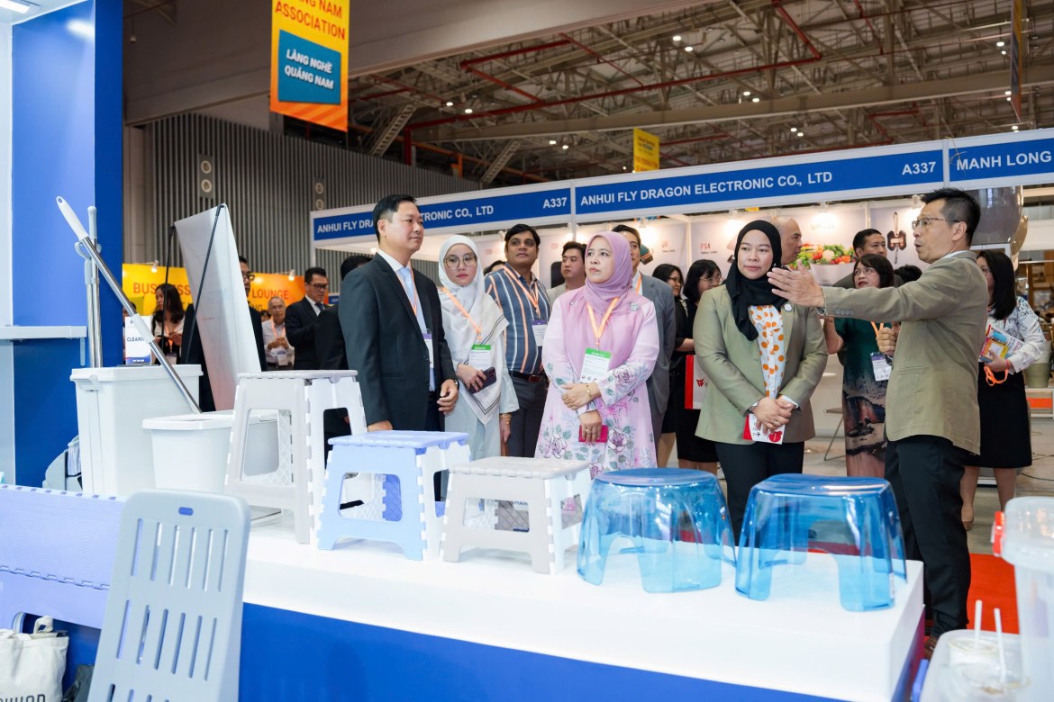 International delegation visiting a plastic goods supplier booth at Global Sourcing Fair Vietnam